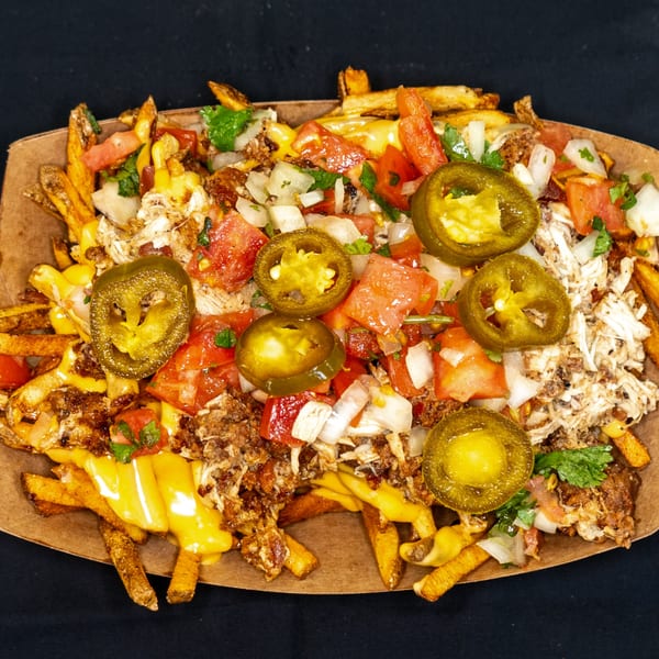 Jackpot's loaded fries with cheese, pulled chicken, diced tomatoes, onions, and jalapeños.